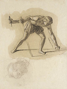 Crouching Male Figure Holding Staff