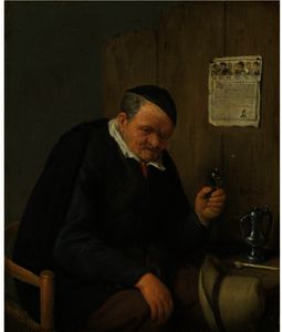 An Elderly Man Seated Holding A Wineglass
