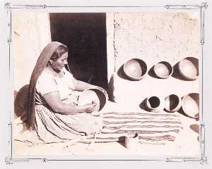 Woman Polishing Pottery