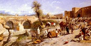 la llegada de una caravana fuera de marrakesh , las montañas de atlas en la distancia