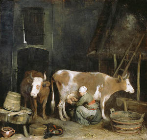 Una cameriera che munge una mucca in un fienile