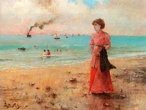 Young woman with red umbrella on the beach