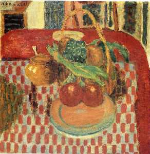 Korb und Platte von Obst auf ein Rot Karierte Tischdecke