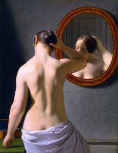 ein akt Frau tuend ihr haar vor einem Spiegel