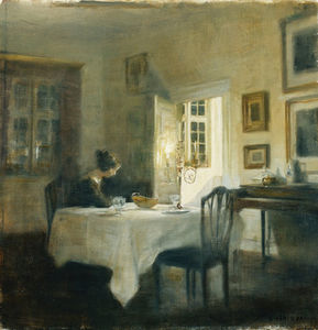A Woman At A Table In A Dining Room