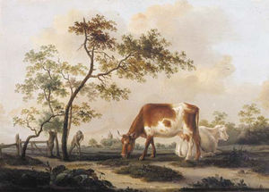 Cows On A Farmyard With A Village In The Distance, In Summer