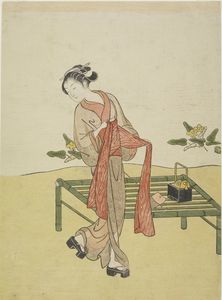 Young Woman Tying Obi Beside Bamboo Bench