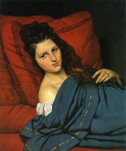 mujer reclinando en un `divan`