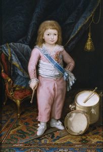 An infant with drum and tambourine