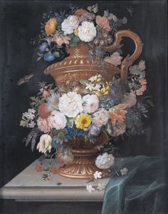 Still life with flowers in a bronze vase on a ledge
