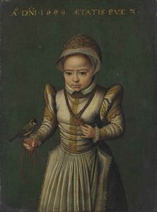 Portrait of a child in a white embroidered dress holding a Great Tit.