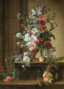 An elaborate still life of flowers in an urn resting on a stone ledge with goldfish in a glass bowl,
