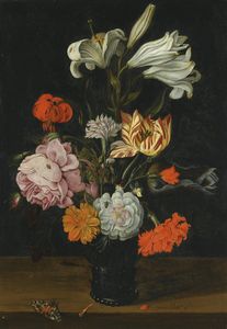 A still life with flowers in a glass roemer, on a ledge with fallen petals