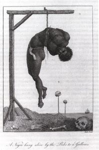 A negro hung alive
