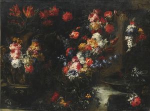 An ornate still life with flowers in vases on a stone ledge