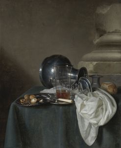 A still life with a pewter jug on its side, a glass of ale, a salt cellar, a bread roll and other objects on a table draped in a dark green cloth