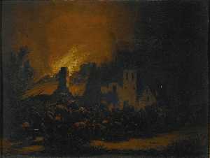 A fire in a village at night