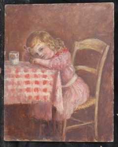 Portrait d'une fillette assise à table