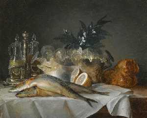 A still life of mackerel, glassware, a loaf of bread and lemons on a table with a white cloth