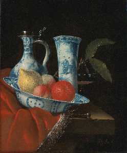 Still life of a blue and white Wan li bowl with peaches, a lemon and an orange, a porcelain ewer and vase, a wine glass and a knife, on a partly draped stone ledge